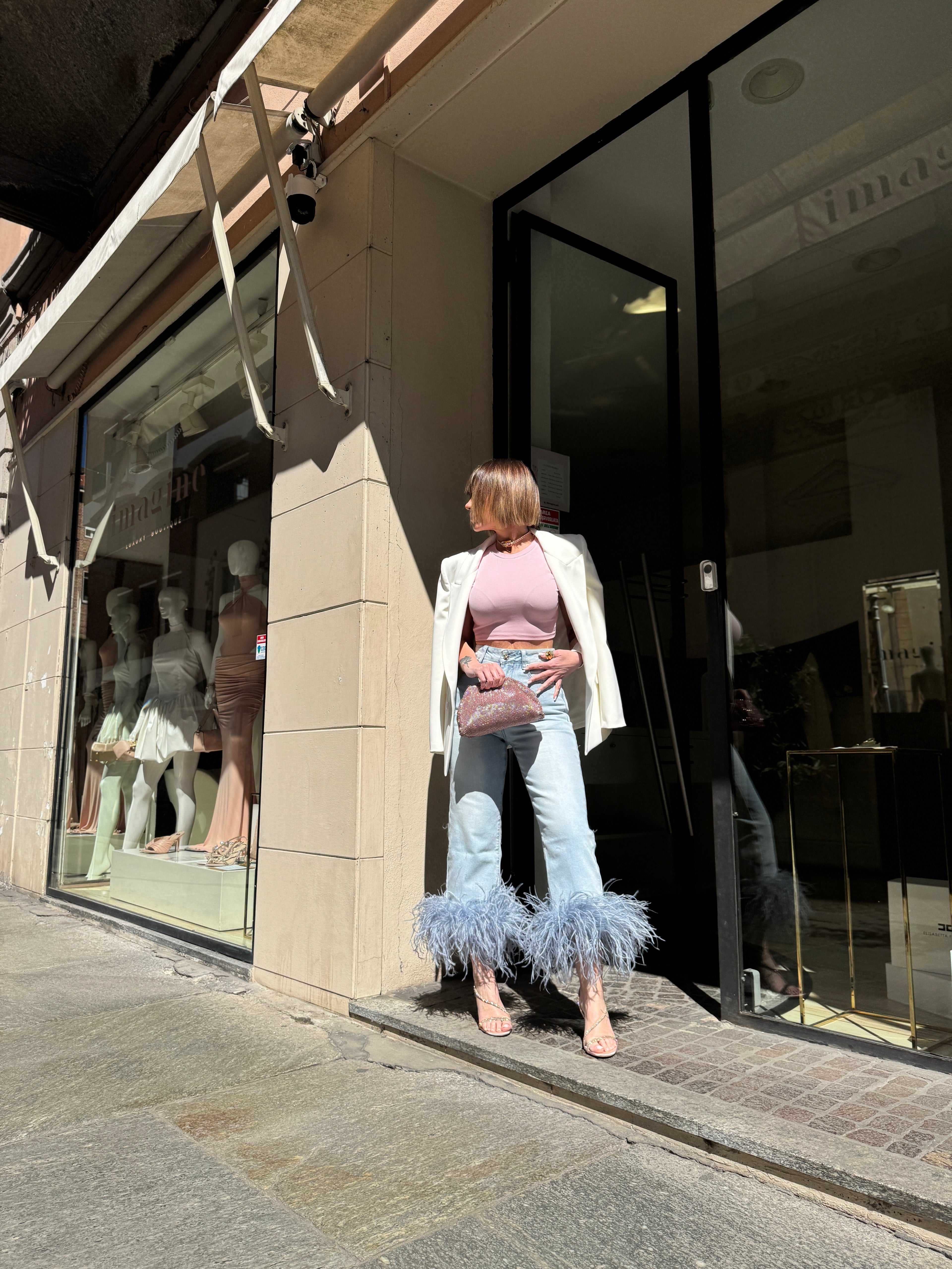 Jeans con piume