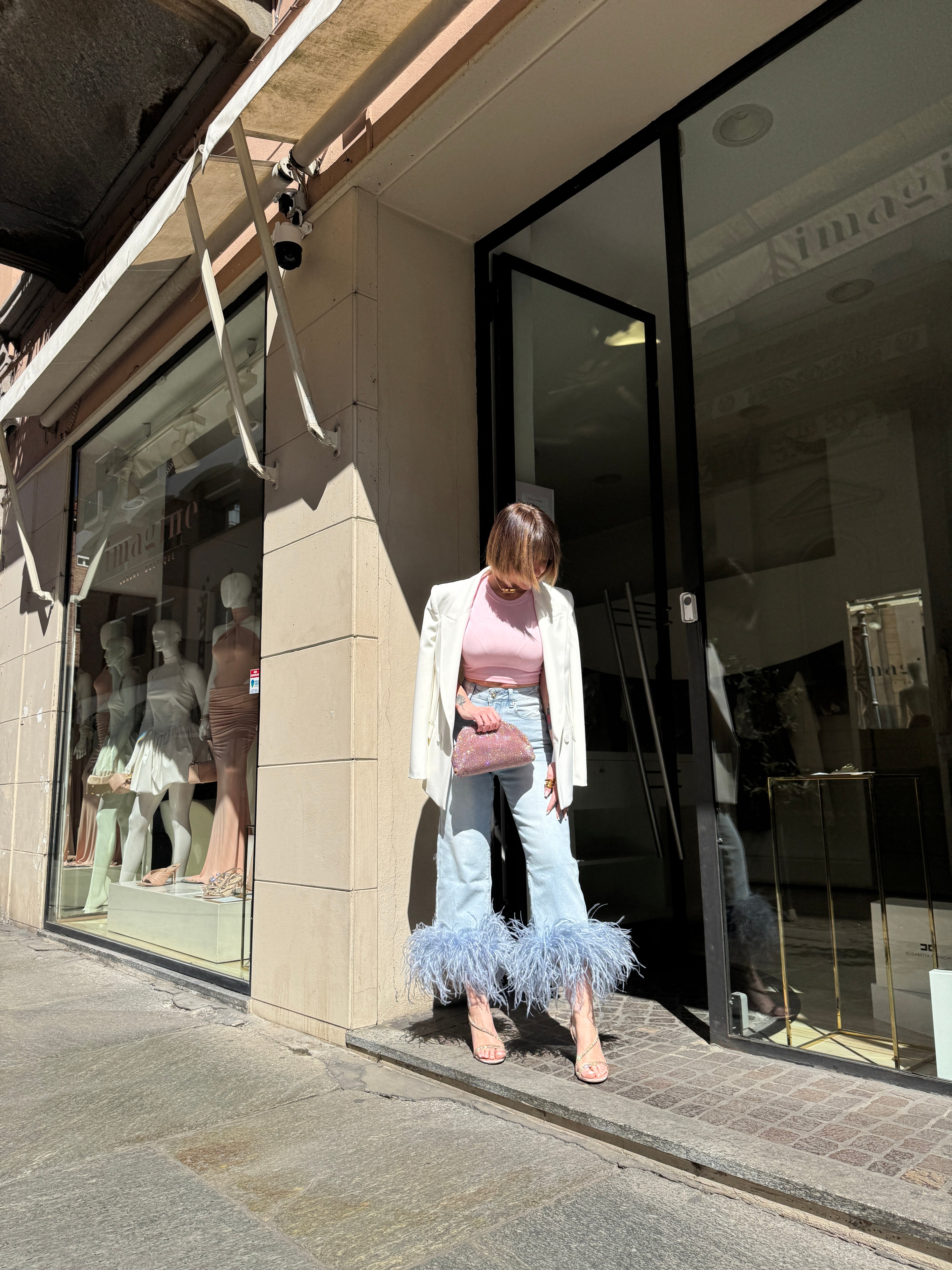Jeans con piume